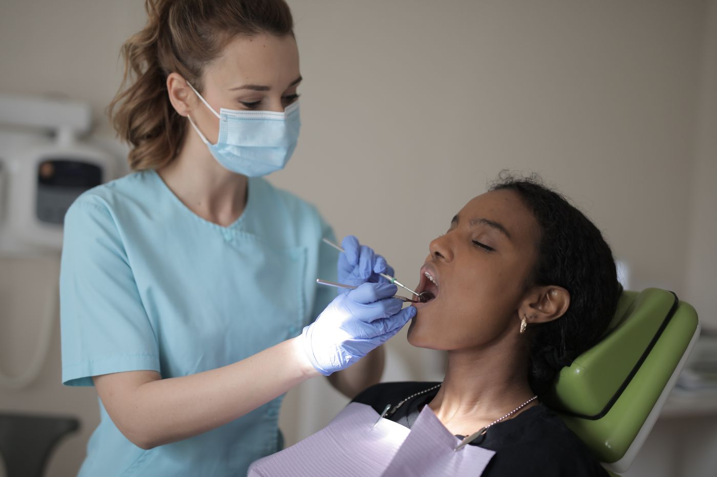 Dentist performing a careful procedure