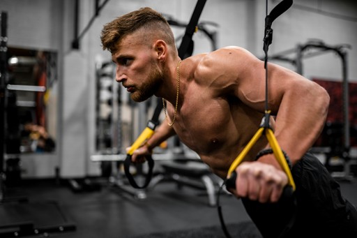 Athlete training with suspension straps